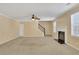 Spacious living room featuring a fireplace and carpet at 1943 Ivy Branch Ct, Loganville, GA 30052