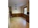 Combined kitchen and dining area with wood paneling and flooring at 3265 Heard Drive, Cumming, GA 30040