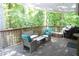 Peaceful deck overlooking backyard, featuring outdoor seating and a shaded area at 34 Timber Chase Dr, Dallas, GA 30157