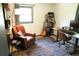 Functional home office with a standing desk, leather chair, and built-in shelving at 34 Timber Chase Dr, Dallas, GA 30157