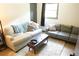 Relaxing living room with two sofas, a coffee table, and a neutral color scheme at 34 Timber Chase Dr, Dallas, GA 30157