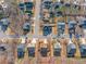 Aerial view of a home with a fenced backyard, nestled in a suburban neighborhood with mature trees at 753 Win West Xing, Auburn, GA 30011