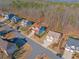 Aerial view of a suburban neighborhood with tree-lined streets and well-maintained homes on spacious lots at 753 Win West Xing, Auburn, GA 30011