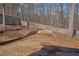 Sloped backyard with firepit and privacy fence at 753 Win West Xing, Auburn, GA 30011