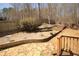 Backyard features a stone patio and beautiful landscaping, creating a tranquil outdoor space at 753 Win West Xing, Auburn, GA 30011