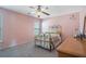 Serene pink bedroom with a decorative metal bed frame and soft lighting at 753 Win West Xing, Auburn, GA 30011