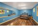 Large bedroom featuring hardwood floors, blue walls and a mirrored wall at 753 Win West Xing, Auburn, GA 30011