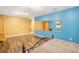 Bedroom featuring hardwood floors, blue and yellow walls, and a decorative queen bed at 753 Win West Xing, Auburn, GA 30011