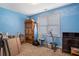 Bedroom with blue walls, a window, and ample storage at 753 Win West Xing, Auburn, GA 30011