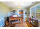 Bright dining area with piano, guitar, and view into kitchen at 753 Win West Xing, Auburn, GA 30011