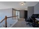 Open hallway with neutral tones, carpeting, and natural wood handrail at 753 Win West Xing, Auburn, GA 30011