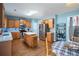 Kitchen featuring wooden cabinets, stainless steel appliances, hardwood floors, and an island at 753 Win West Xing, Auburn, GA 30011