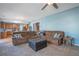 Comfortable living room featuring a large sectional sofa, ottoman, and modern ceiling fan at 753 Win West Xing, Auburn, GA 30011