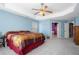 Large main bedroom with king-size bed and access to the bathroom at 753 Win West Xing, Auburn, GA 30011