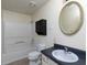 Simple bathroom with shower/tub combo, toilet, and vanity at 826 Shore Drive, Lithonia, GA 30058