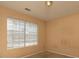 Well-lit bedroom with window and neutral walls at 826 Shore Drive, Lithonia, GA 30058