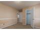 Simple bedroom with closet and neutral walls at 826 Shore Drive, Lithonia, GA 30058