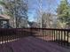 Wooden deck overlooking backyard with trees at 826 Shore Drive, Lithonia, GA 30058