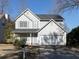 Two-story house with gray siding, a two-car garage, and a well-maintained lawn at 826 Shore Drive, Lithonia, GA 30058