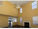 Two-story living room with fireplace, hardwood floors, and lots of windows at 826 Shore Drive, Lithonia, GA 30058