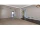 Spacious carpeted living room with access to deck at 826 Shore Drive, Lithonia, GA 30058