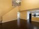 Open living room with high ceilings, hardwood floors, and kitchen views at 826 Shore Drive, Lithonia, GA 30058