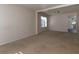 Open living room with carpeted floor and natural light at 826 Shore Drive, Lithonia, GA 30058