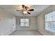 Bedroom with two windows and ceiling fan at 2714 Legislative Ln, Buford, GA 30519