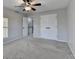 Bedroom with double doors and ceiling fan at 2714 Legislative Ln, Buford, GA 30519