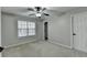 Bright bedroom featuring a large window and ceiling fan at 2714 Legislative Ln, Buford, GA 30519