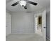 Well-lit bedroom with neutral walls and ceiling fan at 2714 Legislative Ln, Buford, GA 30519