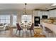 Dining area with hardwood floors and modern table set at 2714 Legislative Ln, Buford, GA 30519