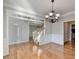 Formal dining room with hardwood floors and chandelier at 2714 Legislative Ln, Buford, GA 30519