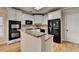 Modern kitchen with granite countertops, white cabinets, and stainless steel appliances at 2714 Legislative Ln, Buford, GA 30519