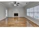 Spacious living room with hardwood floors, fireplace and lots of natural light at 2714 Legislative Ln, Buford, GA 30519