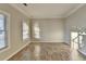 Bright living room with tile floors and large windows at 2714 Legislative Ln, Buford, GA 30519