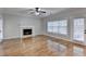 Spacious living room with hardwood floors, fireplace and lots of natural light at 2714 Legislative Ln, Buford, GA 30519