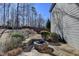 Stone patio with fire pit, perfect for outdoor entertaining at 2714 Legislative Ln, Buford, GA 30519