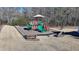 Community playground with slides, climbing structures, and benches at 2714 Legislative Ln, Buford, GA 30519