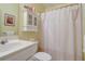 Bathroom with white cabinets, a shower with a curtain and a large, white sink at 3529 Flowering Spgs, Powder Springs, GA 30127