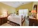 Cozy bedroom with a classic wooden bed frame and neutral decor at 3529 Flowering Spgs, Powder Springs, GA 30127