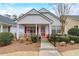 Charming one-story home with a welcoming front porch and manicured landscaping at 3529 Flowering Spgs, Powder Springs, GA 30127