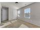Bright bedroom with two windows allowing for ample natural light and neutral carpeting at 7369 Saint Peter Way, Fairburn, GA 30213