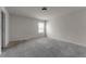 Spacious bedroom featuring plush carpeting and a window for natural light at 7369 Saint Peter Way, Fairburn, GA 30213