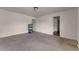 Neutral bedroom with two entry ways featuring plush carpeting at 7369 Saint Peter Way, Fairburn, GA 30213