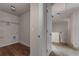 Convenient laundry area with wood flooring and shelving at 7369 Saint Peter Way, Fairburn, GA 30213