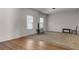 Spacious living room featuring hardwood floors and neutral walls at 7369 Saint Peter Way, Fairburn, GA 30213
