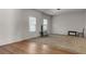 Living room with hardwood and carpeted floors at 7369 Saint Peter Way, Fairburn, GA 30213