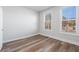 Bright bedroom featuring wood-look flooring and shiplap accent wall at 860 Constellation Dr, Decatur, GA 30033