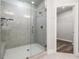 Large walk-in shower with glass enclosure and gray tile at 860 Constellation Dr, Decatur, GA 30033